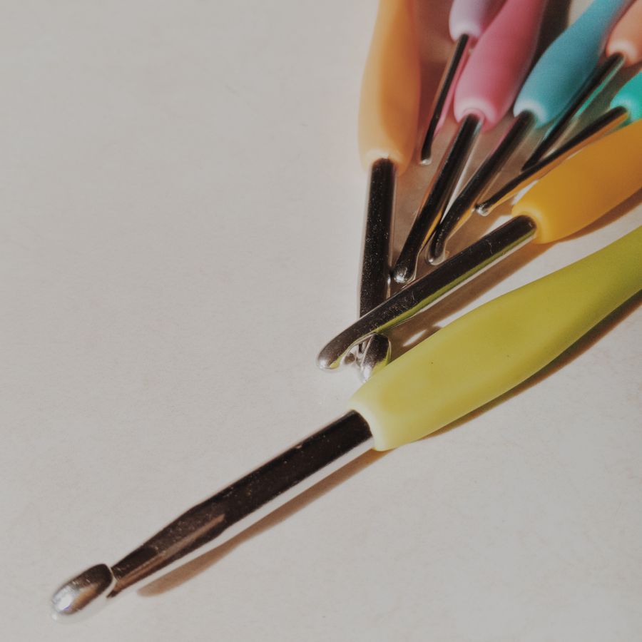 A fan of crochet hooks with pastel grips